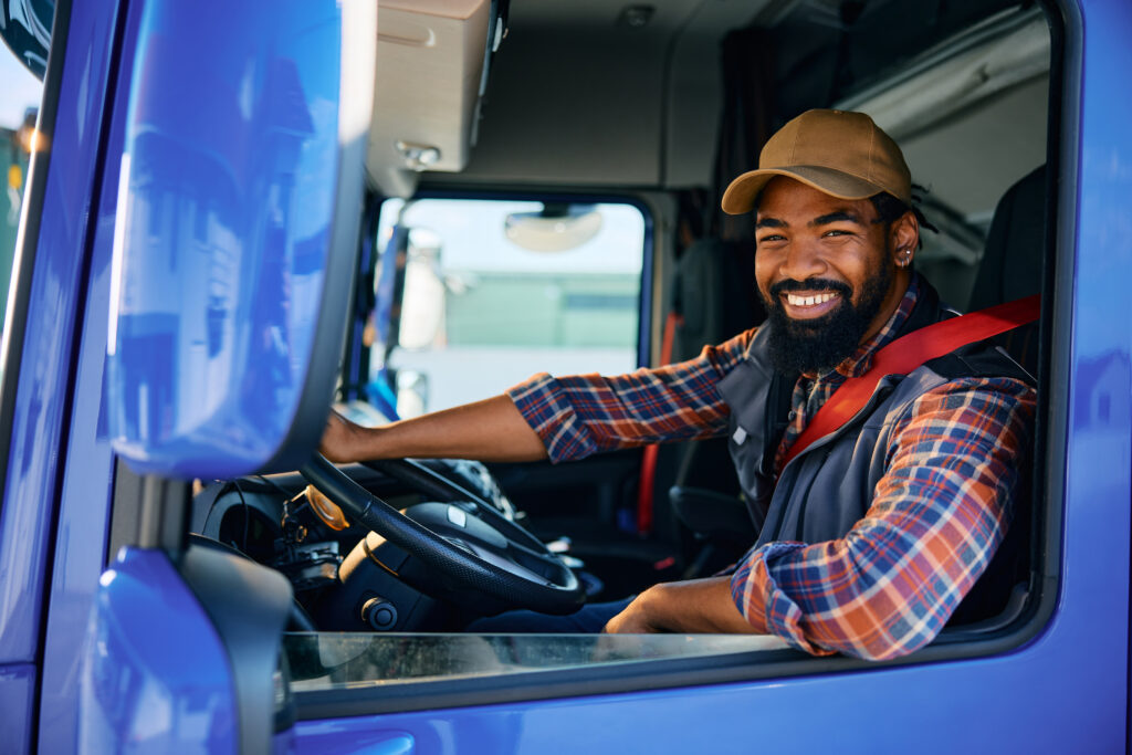 truck driver smiling because he switched to a regional truck driving job