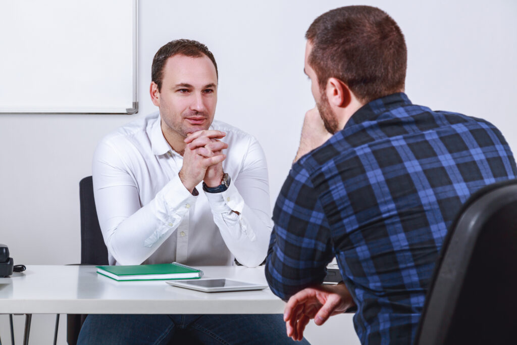 Job applicant talking to truck driver recruiter